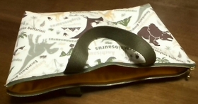 zippered tote bag with dinosaur pattern